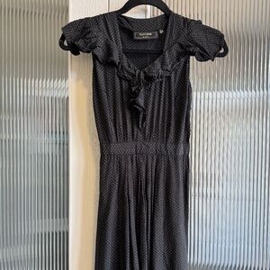 Black minidress with tan polka dots